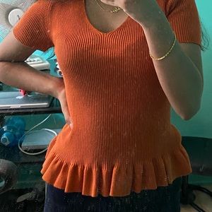 orange ribbed peplum top